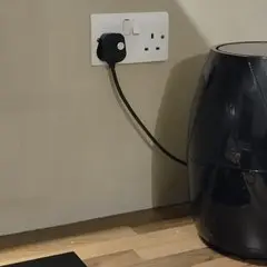 Photo of a plug in a wall socket